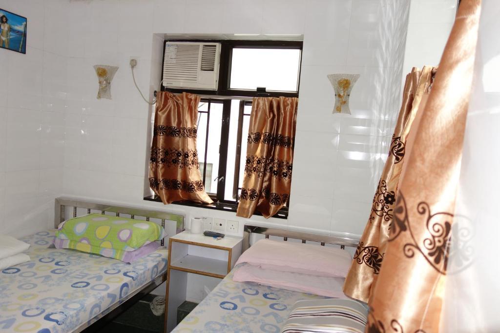 New China Guesthouse Hongkong Pokoj fotografie